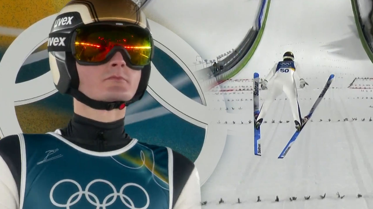 Domen Prevc med skokom na srednji skakalnici v Predazzu na olimpijskih igrah