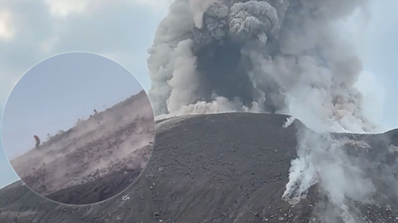 Dramatičen beg skupine pohodnikov pred padajočim kamenjem na vulkanu Santiaguito